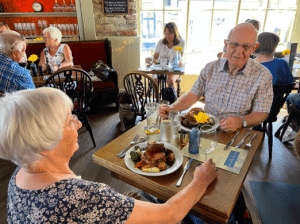 Couple having. meal at the New Quay Inn, Brixham